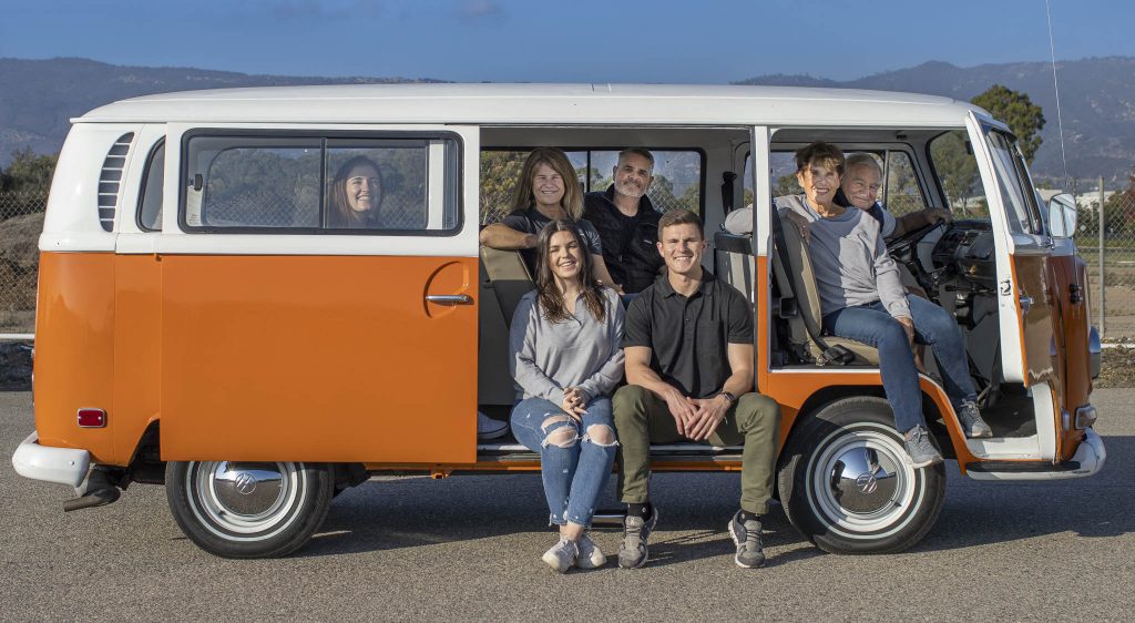 Three generations of the Caird family in a 1960s Volkswagen Bus